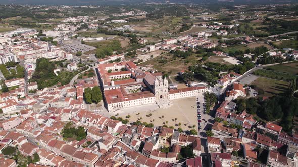 Alcobaca cityscape and the famous monastery. Magnificent gothic monuments in Portugal. Aerial view