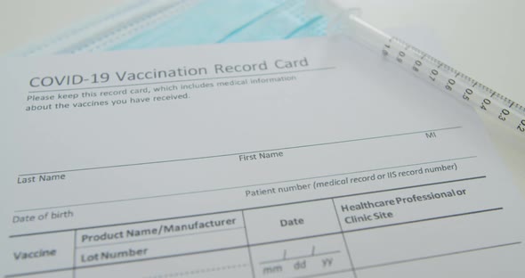 Medical Mask and COVID19 Vaccine on Vaccination Record Card Approved By CDC with Corona Virus