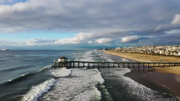 Static aerial shot of the pier at Manhattan Beach in California. Beautiful summer sun