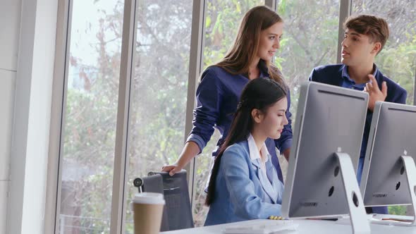 Businesswoman and Businessman Having Conversation in Modern Office