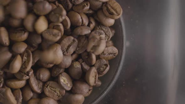 Coffee beans being poured into grinder