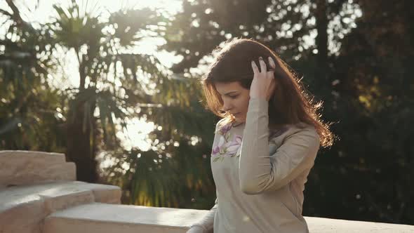 Adult Inspired Woman Is Standing Alone in Sunny Garden, Side View