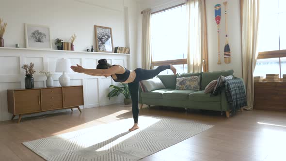 Young Indian Woman doing balance exercise and Stretching sports Yoga, Black Sportswear Leggings 