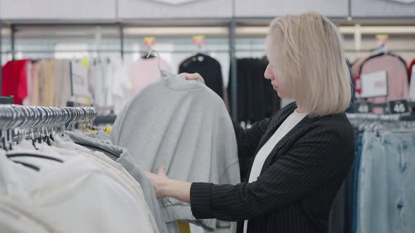 Elegant Woman in a Clothing Store