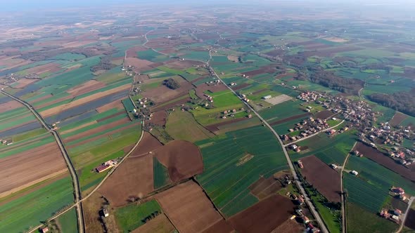 Colored Fields and Village on the Plain