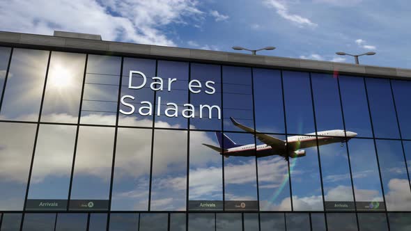 Airplane landing at Dar es Salaam Tanzania airport mirrored in terminal