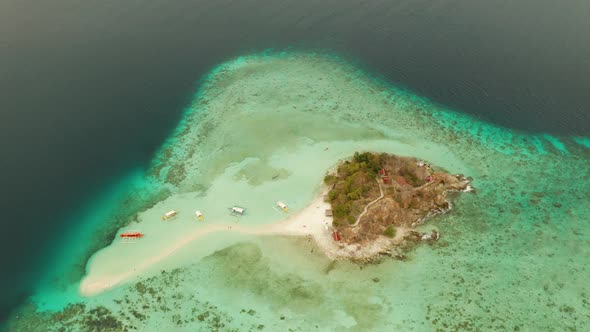 Small Torpic Island with a White Sandy Beach Top View