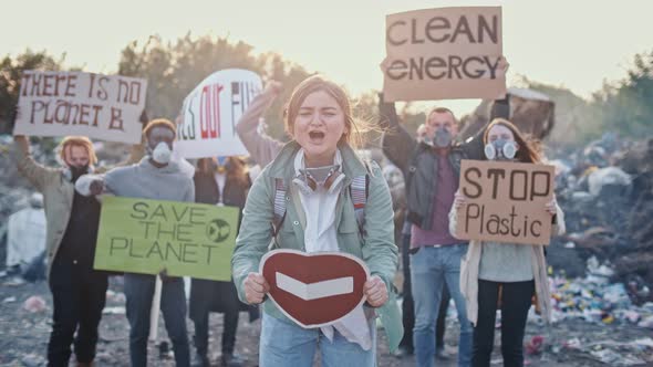 Portrait of Attractive Young Woman Activist Holding Stop Sign