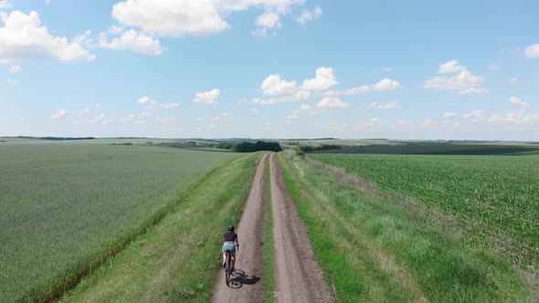 Cyclist riding on gravel bicycle. Gravel Cycling