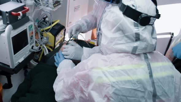 Doctors Putting Respirator on Man with Pneumonia