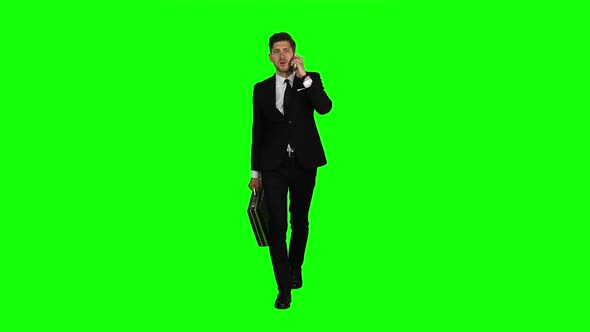 Businessman Is a Diplomat, a Telephone Rings To Him and He Talks. Green Screen