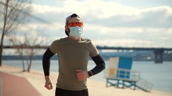 Runner In Face Mask Workout Outdoors.Coronavirus Lockdown Self Distance Activity.Fitness Running