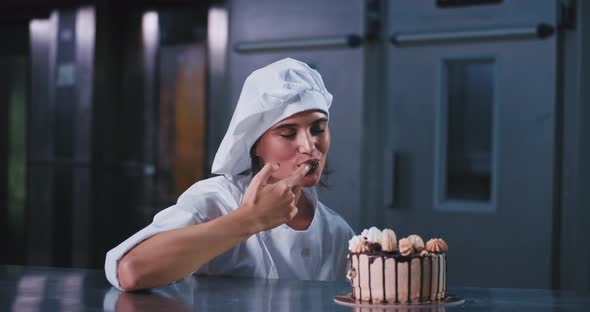 Smiling Excited Young Baker Woman in a Industrial