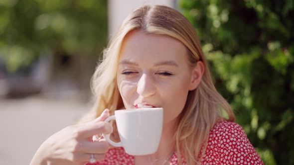 Young Woman with Cup of Coffee