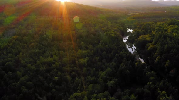 Aerial shot over Piscataquis River at Barrel Falls.