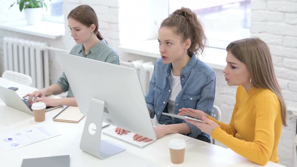 Annoyed Young Startup Team Using Desktop and Arguing