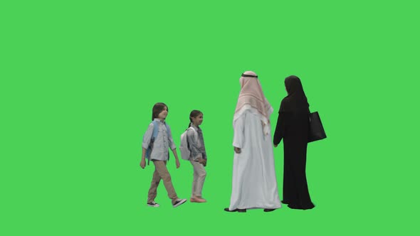 Arabic Adult Parents with two Children walking
