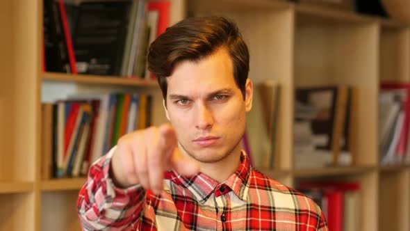 Man Pointing Toward Camera