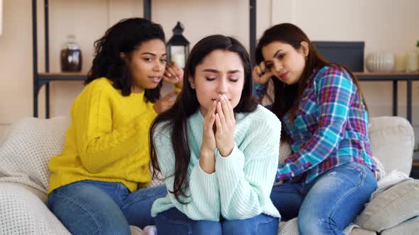 Women Gossiping Behind Back of Stressed Female