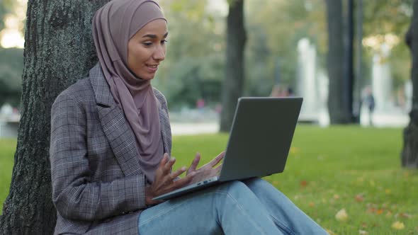 Happy Smiling Friendly Islamic Business Woman Muslim Student Girl Teacher Wearing Hijab Sitting on
