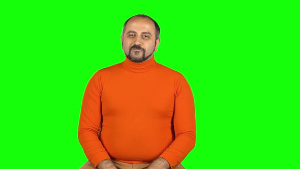 Full Caucasian Man Looking at Camera and Flirting Smiling. Green Screen