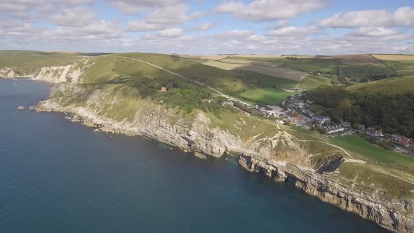 Cornwall aerial drone view of seaside rocky cliffs and turquoise water