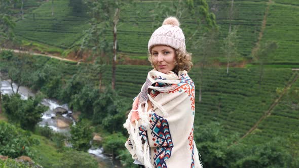 Young Woman In Poncho Enjoying Nature Outdoors