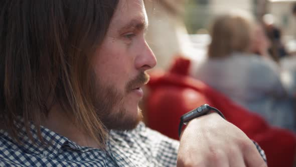 Man with Smartwatch Using Voice Recorder Recognition Audio Message Command Outside on Street