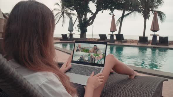 Woman Having Video Chat with Relatives