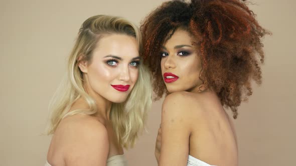 Blonde and Curly Women in Studio