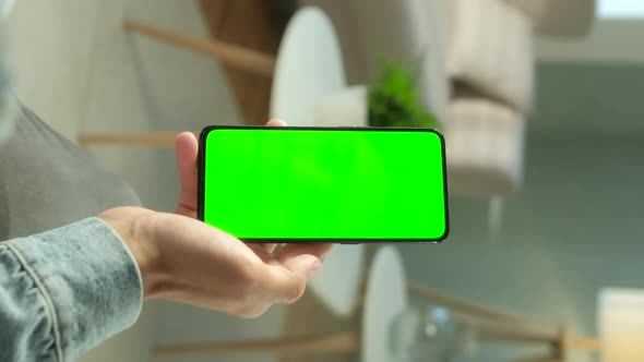 POV View of Man at Phone with Green Screen for Copy Space. Chromakey Mock Up Without Tracking