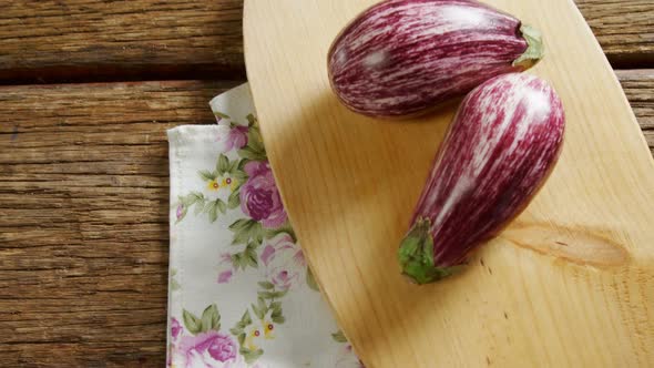 Two eggplant on chopping board 4k