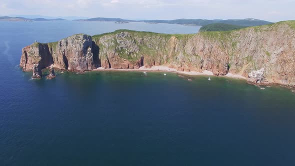 View From a Drone of the Coastline with a Rocky Coast Island of Shkot