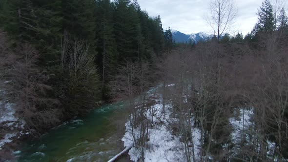 Aerial View of Chilliwack River with Snow During Winter Season