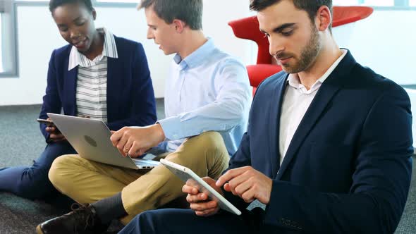 Business colleagues using laptop and digital tablet 4k