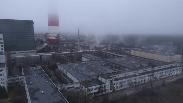 Aerial View From a Drone to a Thermal Power Plant in Cloudy Foggy Weather