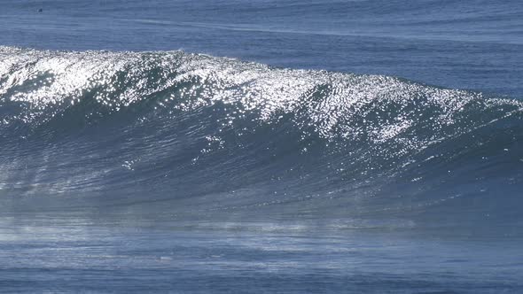Waves break in surf line.