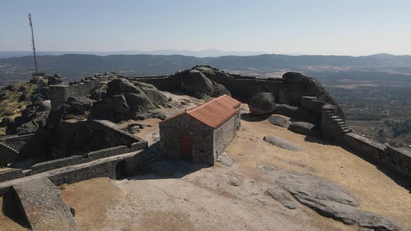 Old building at Monsanto ruins, Portugal. Aerial circling