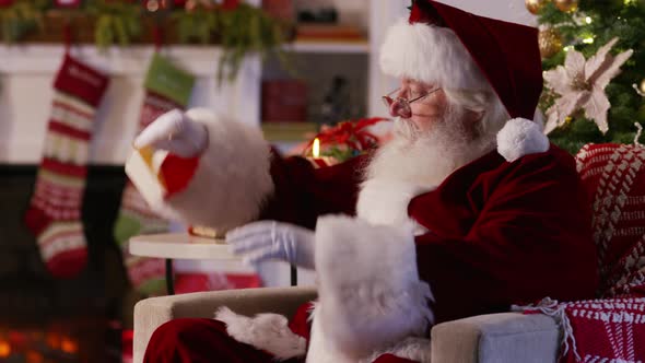 Santa Claus reading letter from child alt