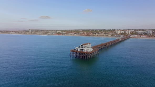 drone orbit view over famous long Pier of Oceanside city, South Coast of California, USA