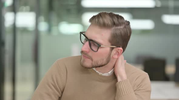 Young Creative Man Having Neck Pain