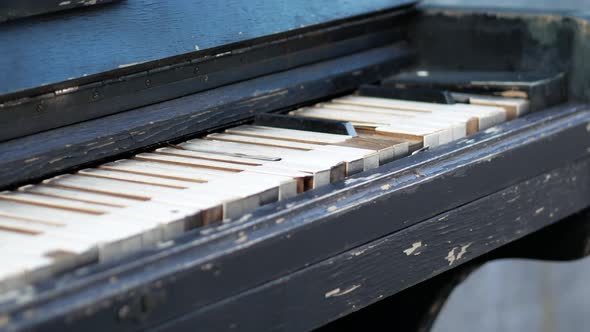 Old Rusty Piano Outdoors. Overview of a Keyboard of an Old Piano. Antique Music Instrument