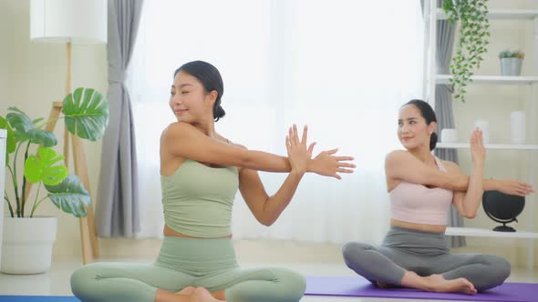 Asian active sport woman learn yoga pilates lesson with coach trainer.