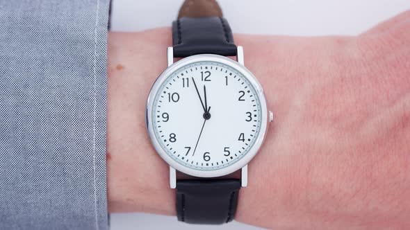 Close up of a man wearing a wrist watch