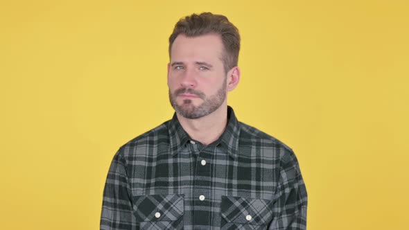 Portrait of Middle Aged Man Shaking Head As No Sign