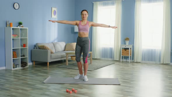 Young Fit Woman Is Warming Up Legs