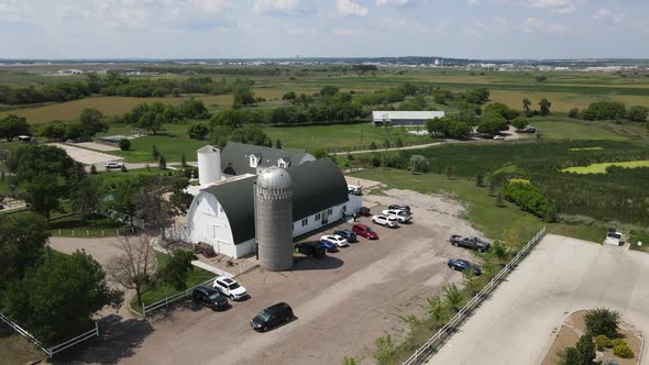 Aerial view of a white building with a gray roof in Bismarck on a sunny day