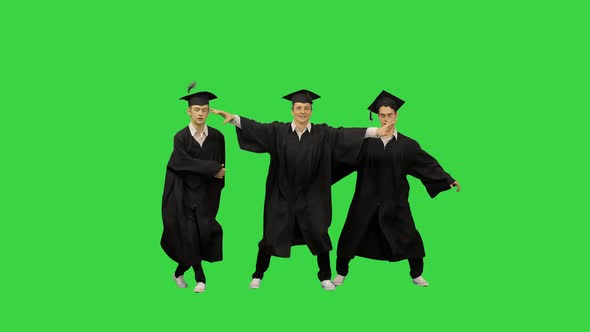 Three Male Graduates in Robes and Mortarboards Dancing in Synch on a Green Screen, Chroma Key.