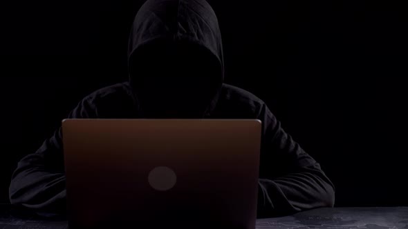 Hacker Using Laptop Computer Hacking With Dark Background