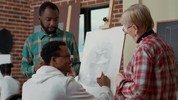 Teacher and Team of Students Talking About Vase Drawing on Canvas